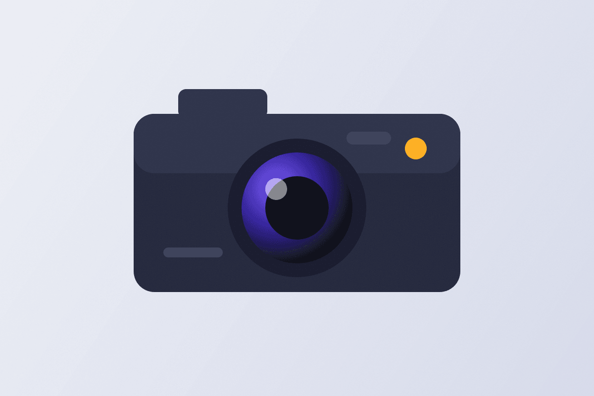 A camera body and lens laid flat on a pale surface